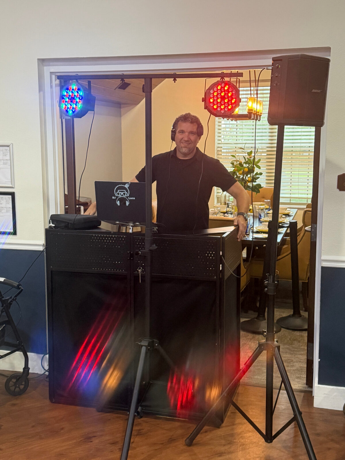 DJ Luce performing with red and blue event lighting